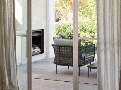 Fauteuil lounge tissé Aireys